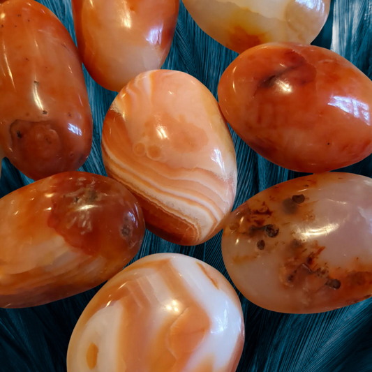 Carnelian Pebble~ Sparks creativity and sexual passion.